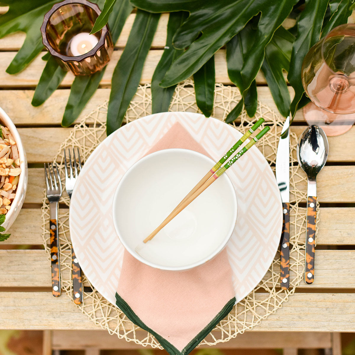 Overhead View of Stylish Individual Place Setting with Chopsticks set atop a Mixture of Pieces from the Beautiful Blush Collection