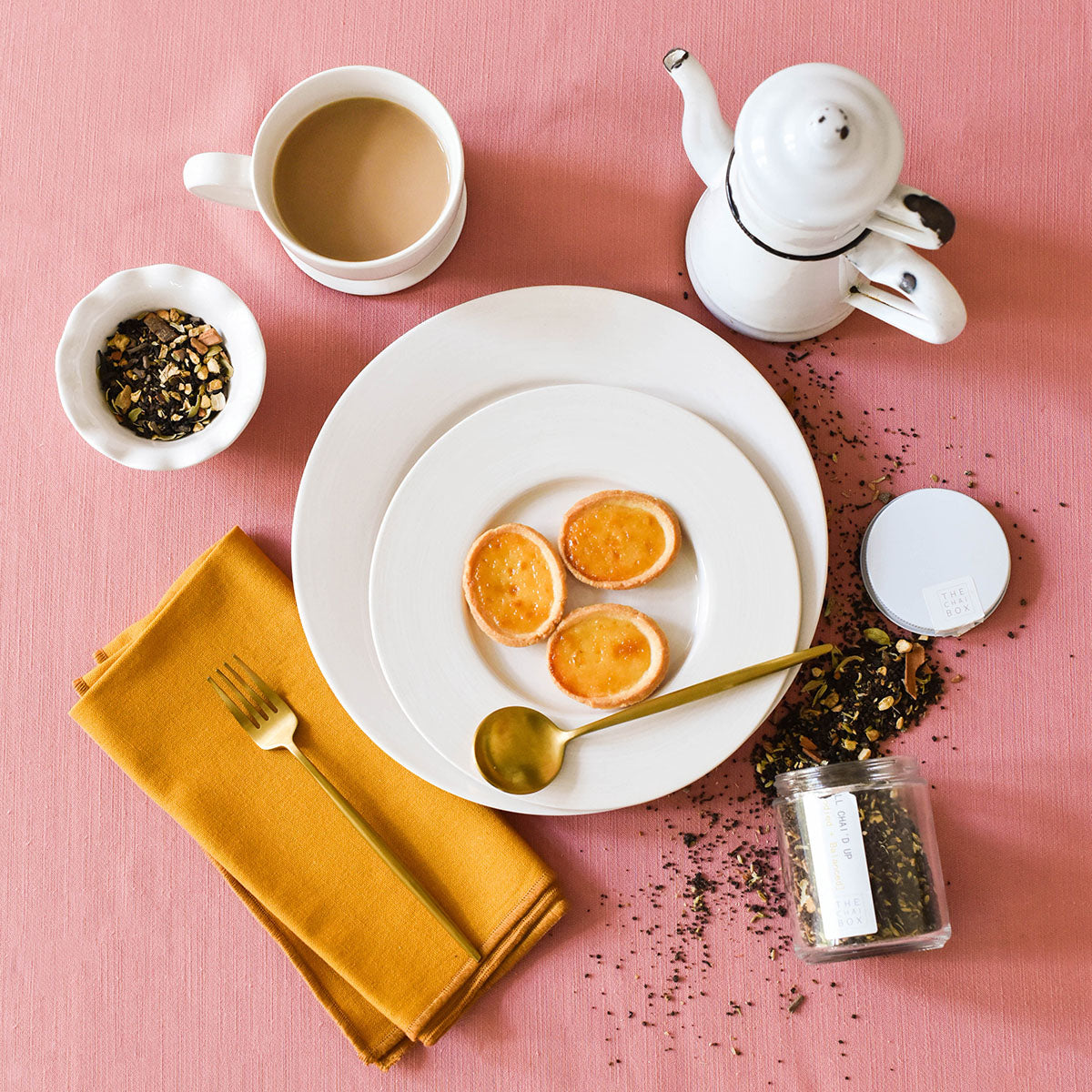 Overhead View of Stylish Individual Place Setting for Afternoon Tea using a Mix of Rimmed Dishes from Signature White collection