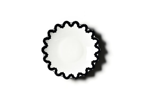 A white pasta bowl with a bold black arabesque scallop design, seamlessly blending with Coton Colors' modern shapes for a striking tablescape statement.