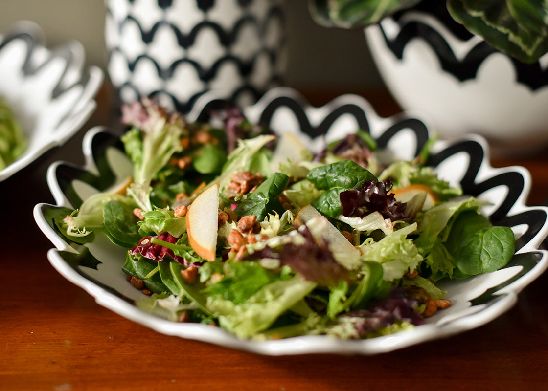 Front View of Salad Served in Black Arabesque Scallop 11in Pasta Bowl Showcasing it's Multi-Function