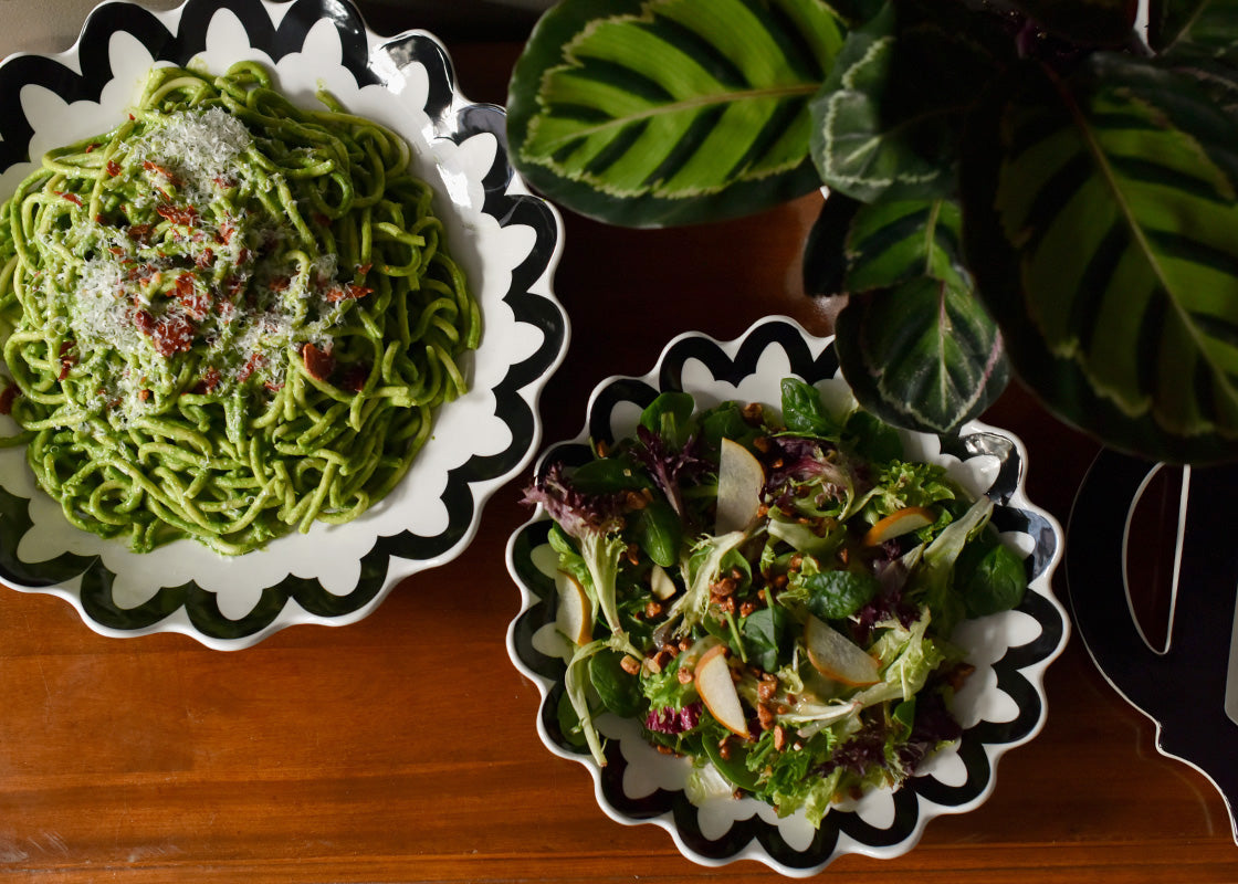 Overhead View of Salad Served in Black Arabesque Scallop 11in Pasta Bowl and Pasta in Larger Bowl Showing their Multi-Function