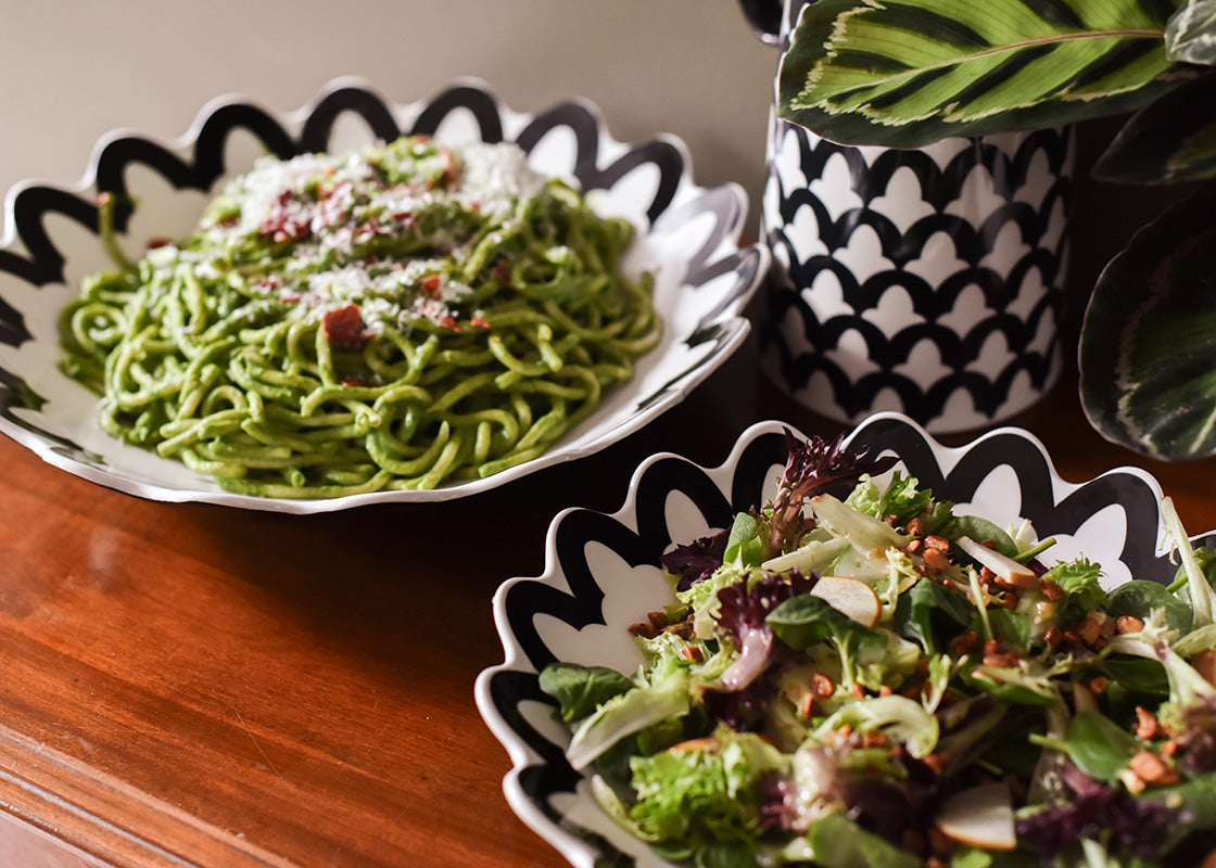 Front View of Salad Served in Black Arabesque Scallop 11in Pasta Bowl and Pasta in Larger Bowl Showing their Multi-Function