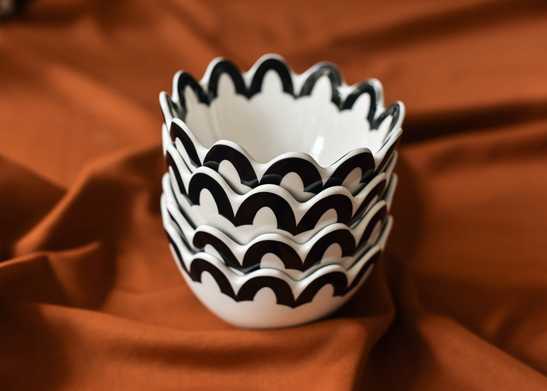 Front View of Stack of Black Arabesque Trim Scallop Small Bowls