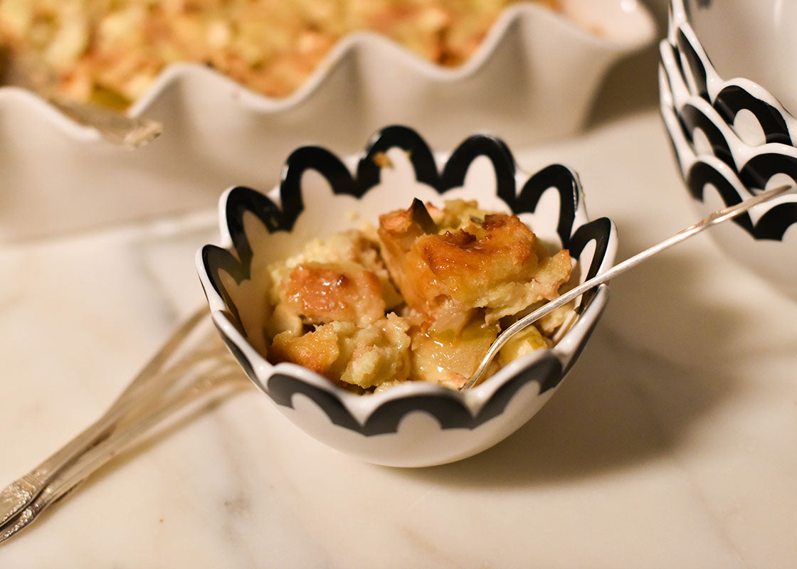 Cropped Close up of Black Arabesque Trim Scallop Small Bowl Filled with Dessert