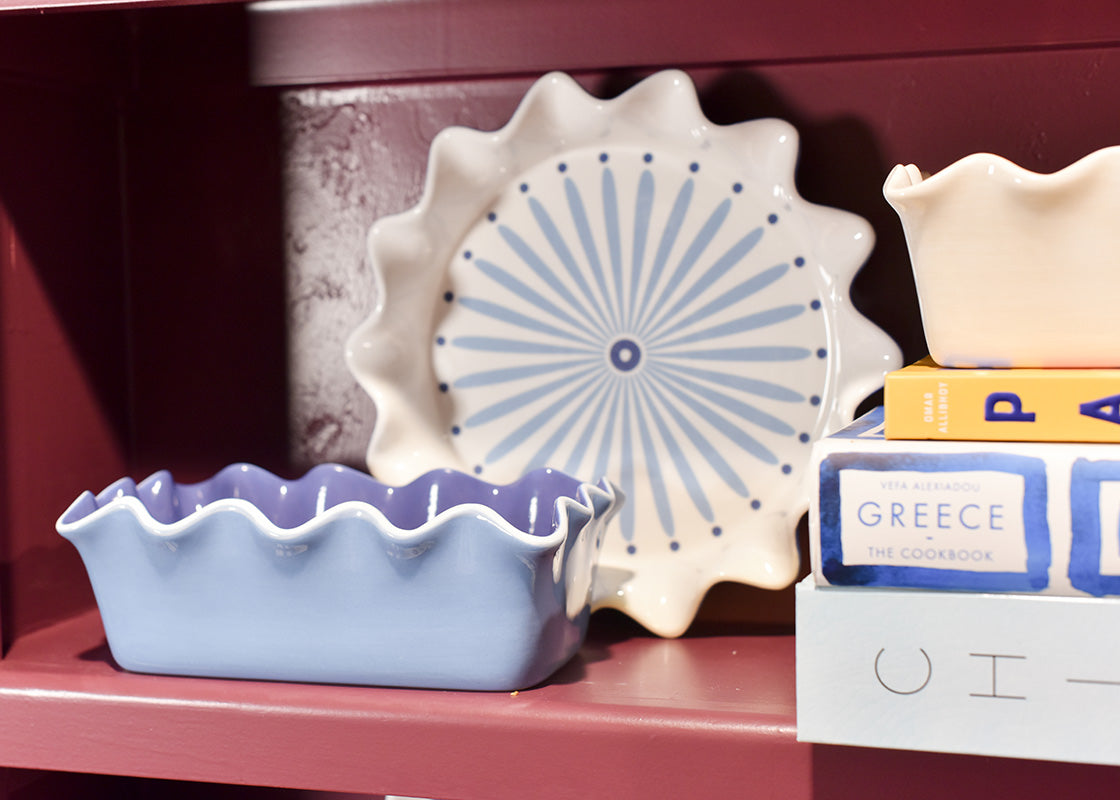 Cropped Close up of Ruffled Bakeware on Shelf creating a Pretty Display with Cookbooks