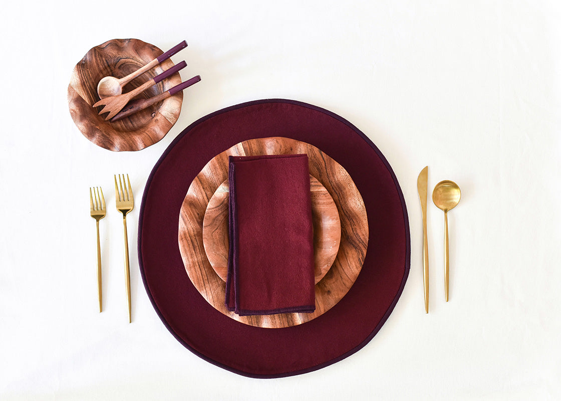 Overhead View of Place Setting with Coordinated Fundamentals Plates Set on Coquette Color Block Round Placemat