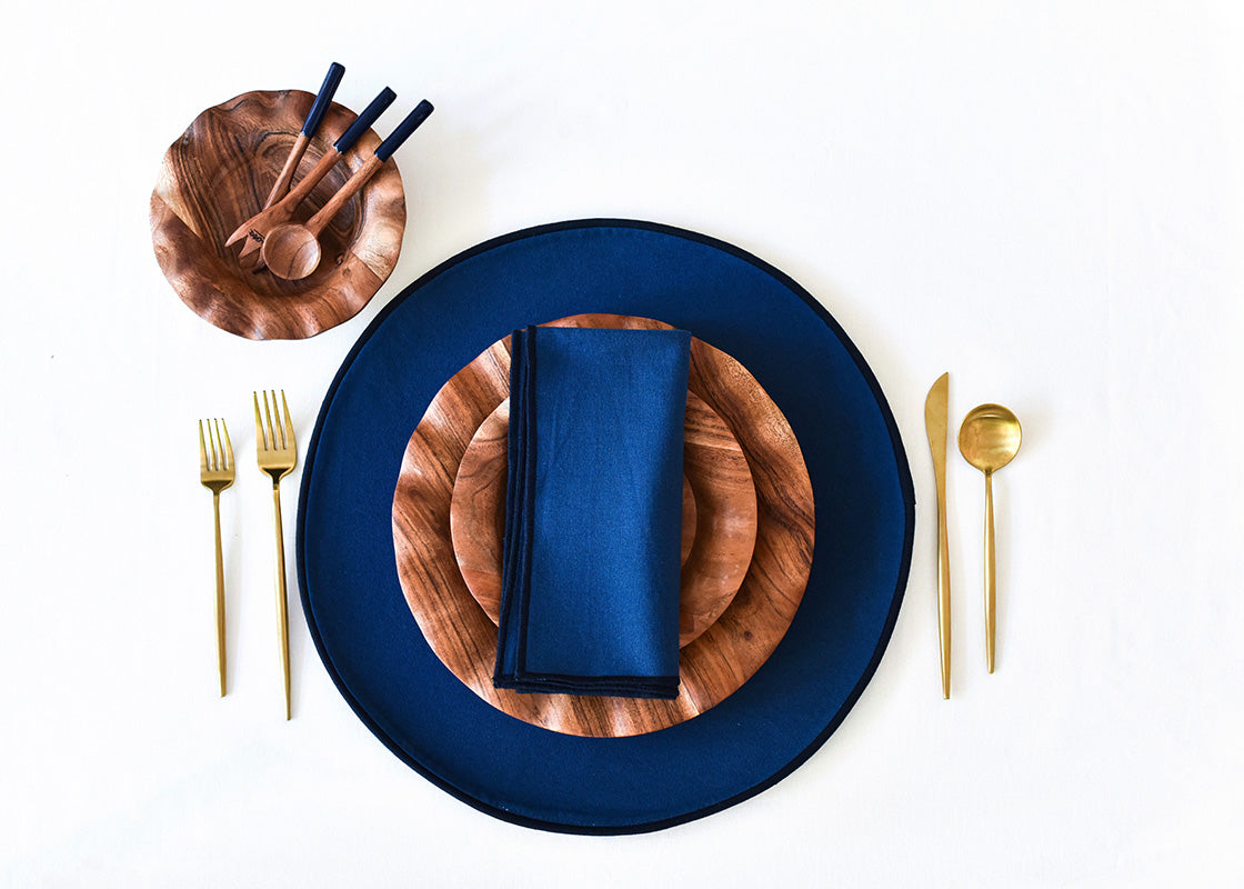 Overhead View of Individual Place Setting Set on Navy Color Block Round Placemat
