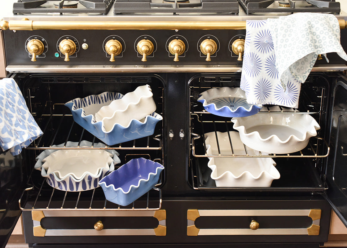 Front View of Stacks of Bakeware on Oven Racks