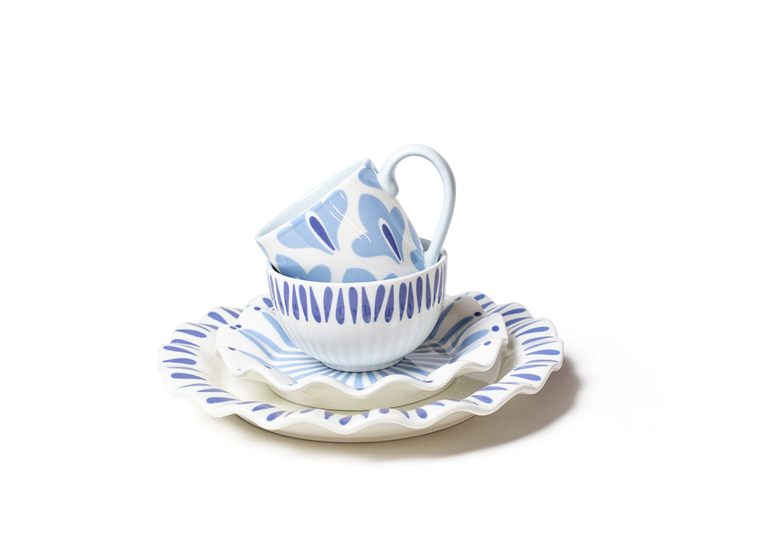 Front View of Coordinating Iris Blue 4 Piece Place Setting Featuring Ruffled Edges and Beautiful Coloring