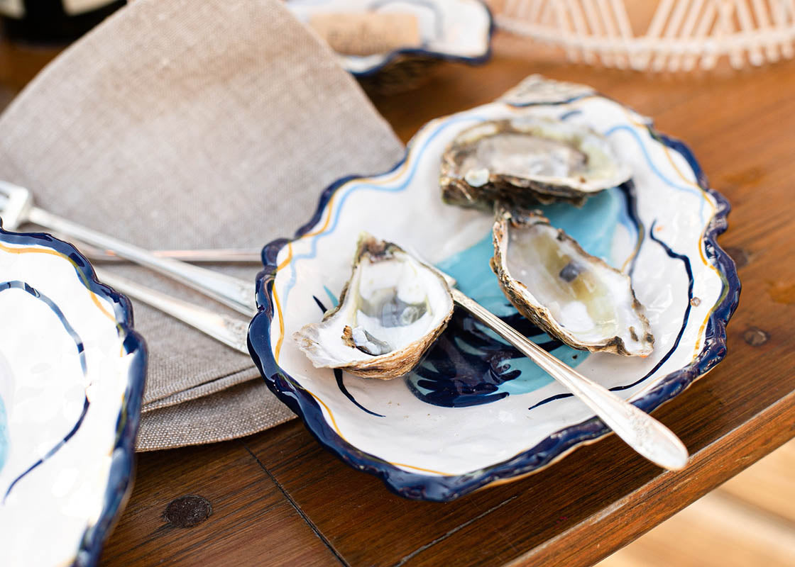 Front View of Oysters Served Up on an Oyster Plate