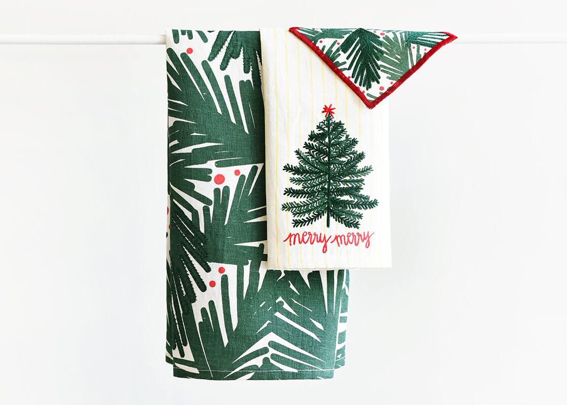 Front View of Mix and Match Holiday Linen Hand Towels Folded and Hanging on Rod