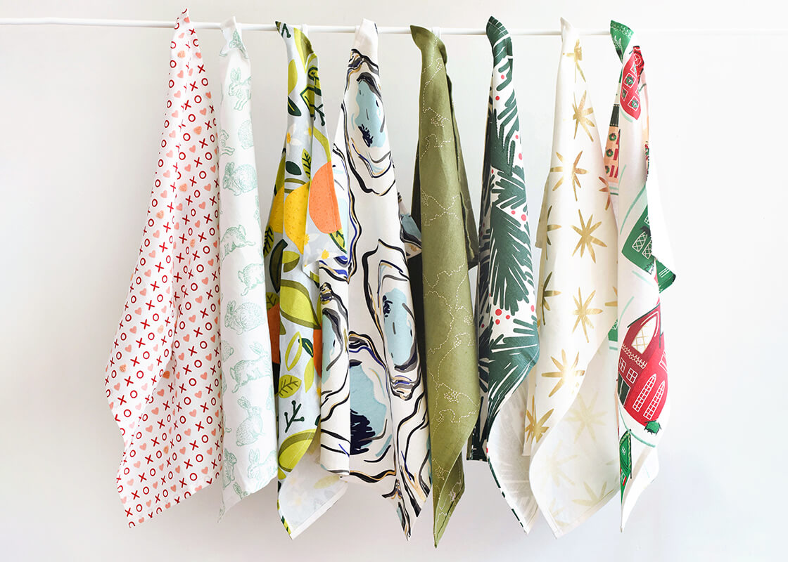 Front View of Creatively Hung Hand Towels Including Large Linen Hand Towels for Every Occasion Hanging by Loop in a Row