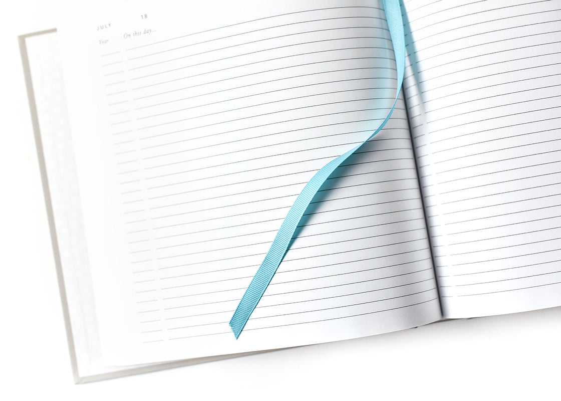 Cropped Close up of Lined Pages and Ribbon Bookmark in Celebrate Every Day Book