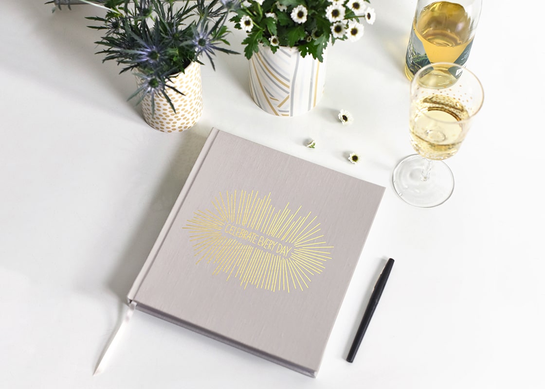 Overhead View of Celebrate Every Day Book with Flowers and Wine