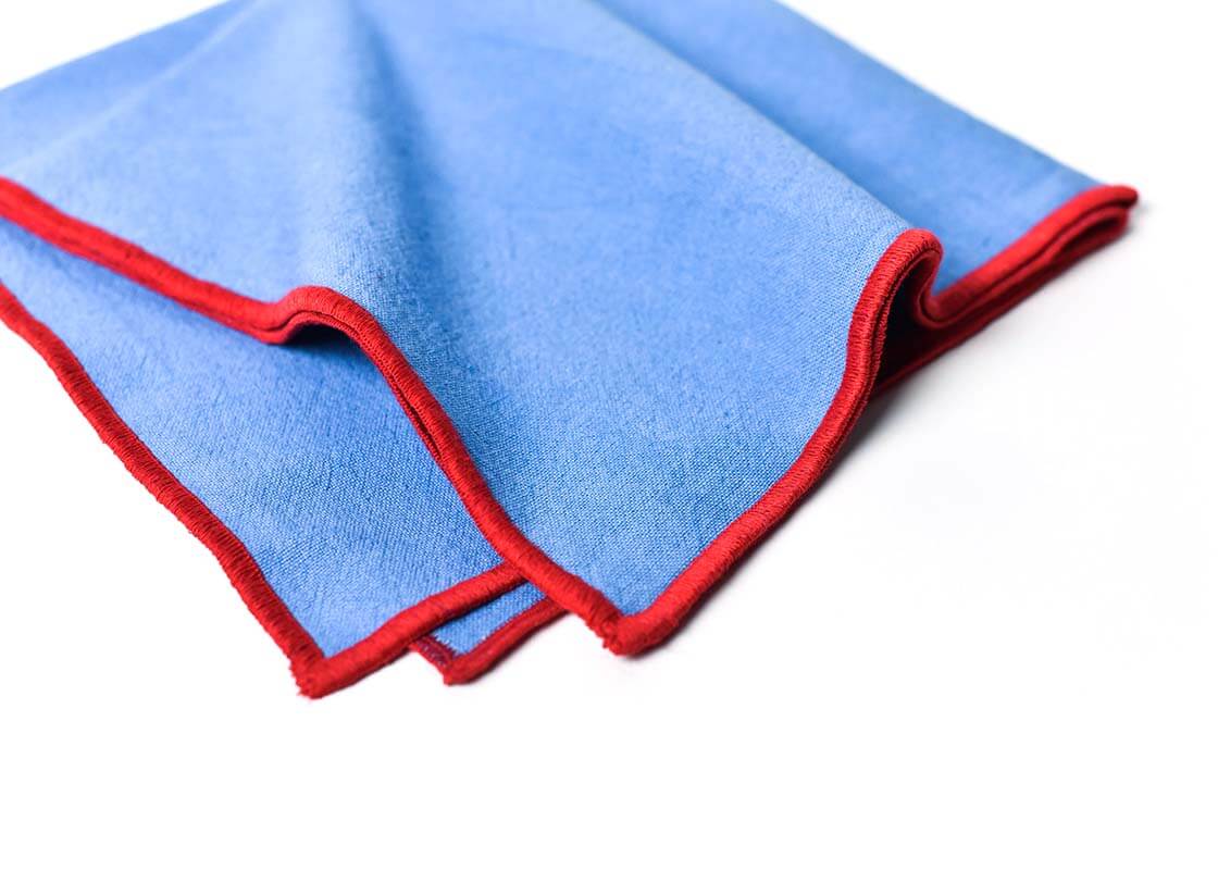 Cropped Close up of Red Embroidered Trim on French Blue and Red Color Block Napkins Set of 4 Showcasing Beautiful Texture of Fabric