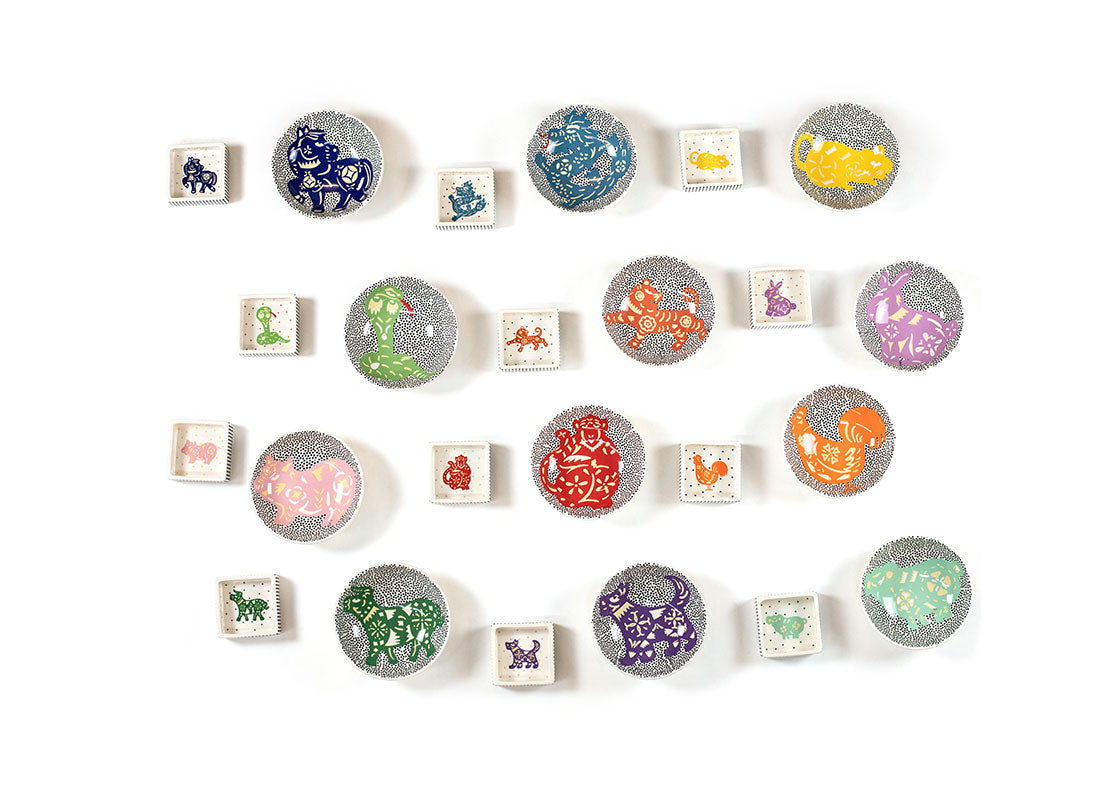 Overhead View of Rows of Chinese Zodiac Bowls and Trinket Bowls Showing all Patterns in Series Including Chinese Zodiac Snake Trinket Bowl