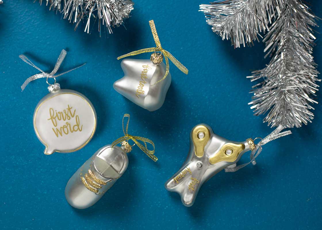 Overhead View of All Four Milestone Ornaments from Baby's First Milestones Set of Ornaments