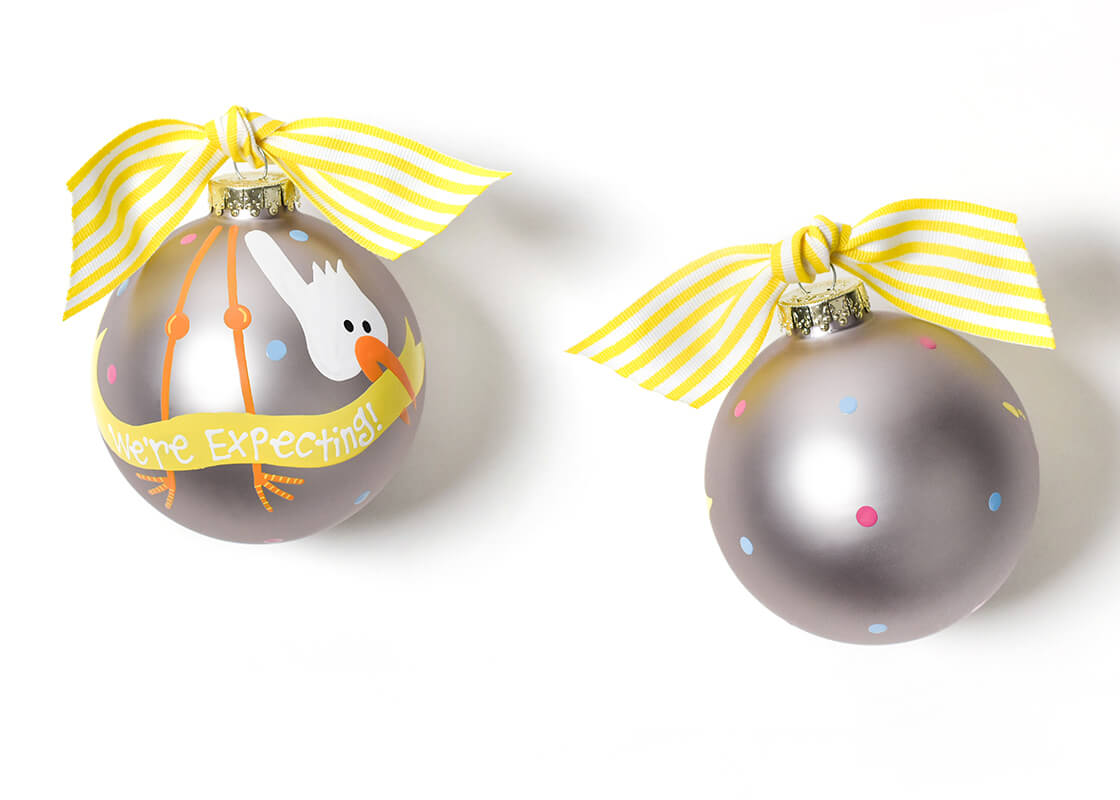 Front and Back View of Stork We are Expecting Glass Ornament Placed Side by Side