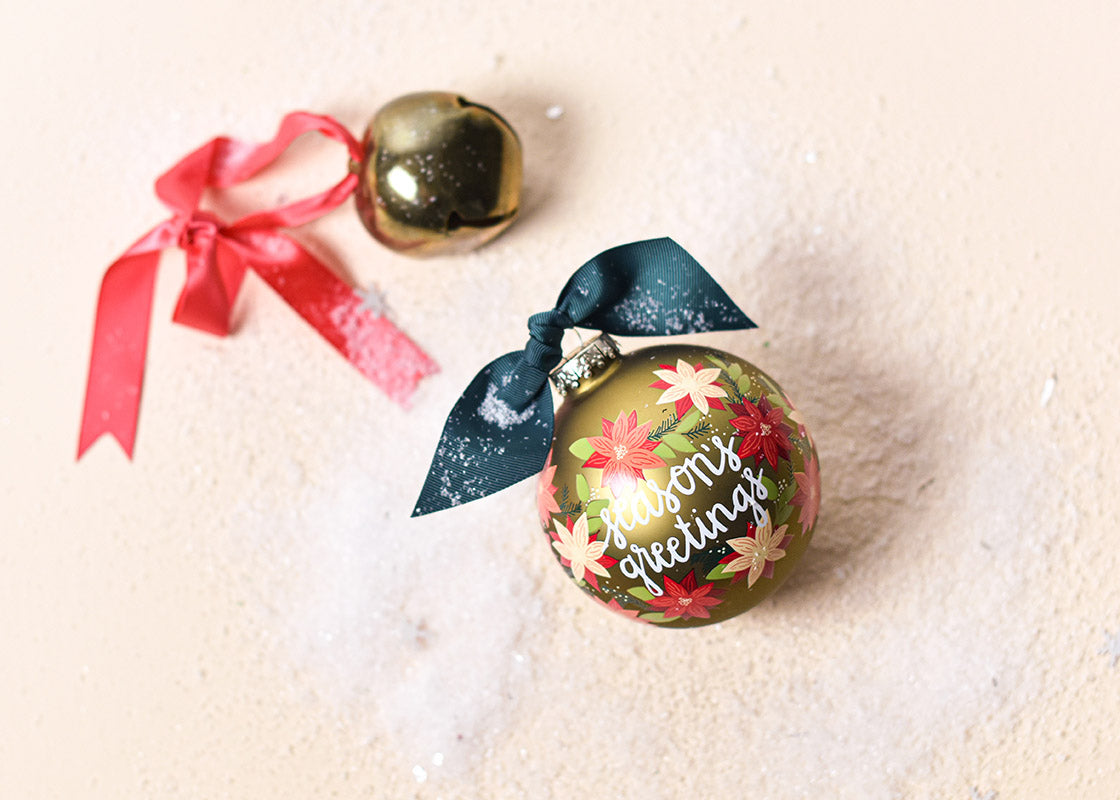 Overhead View of Poinsettia Ornament Christmas Decor with Christmas Bell and Snowflakes
