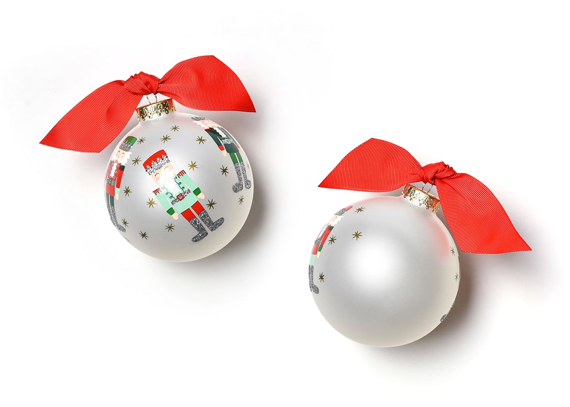 Front and Back View of Nutcracker Glass Ornament Placed Side by Side