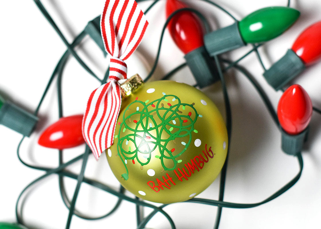 Overhead View of Ornament with Tangled Christmas Lights Design Place on Strand of Christmas Lights