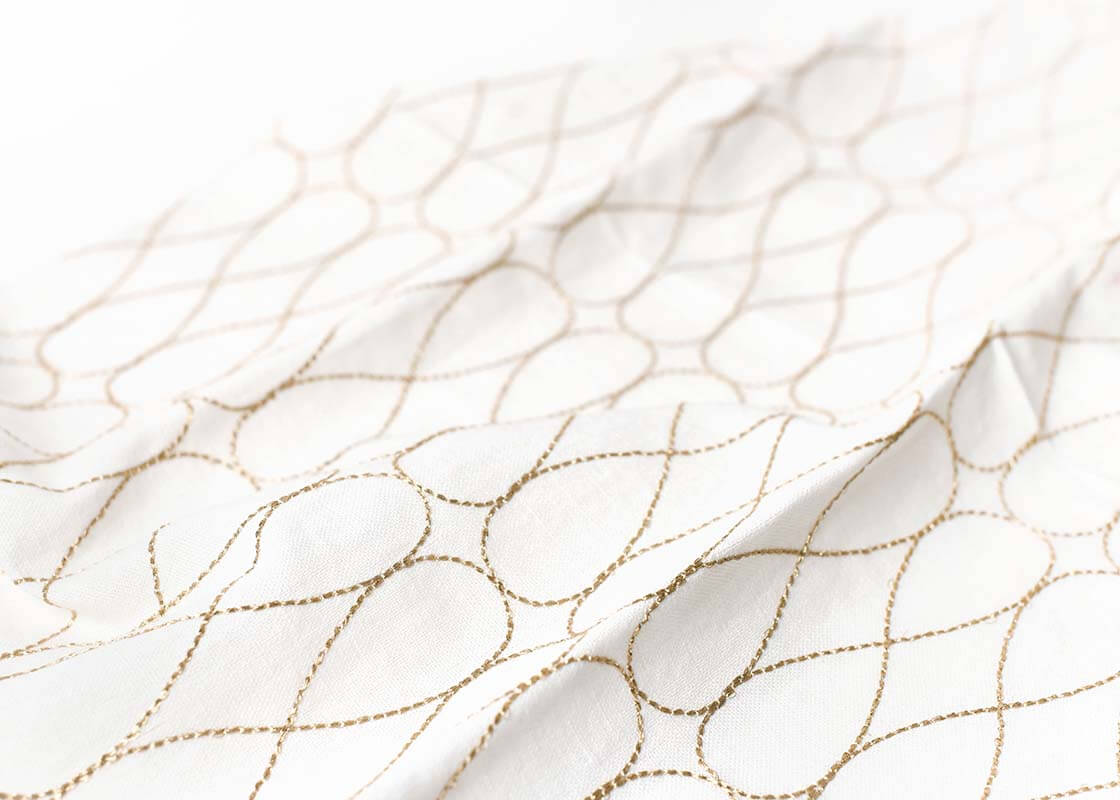 Cropped Close up of Unique Embroidery Technique on Deco Gold Large Hand Towel Showcasing Beautiful Texture of Fabric