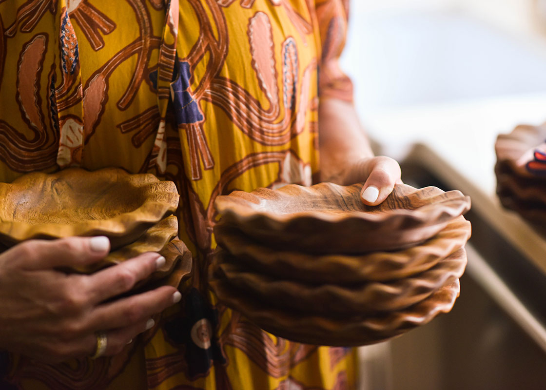 Front View of Woman Carrying Fundamental Wood Ruffle Salad Plates