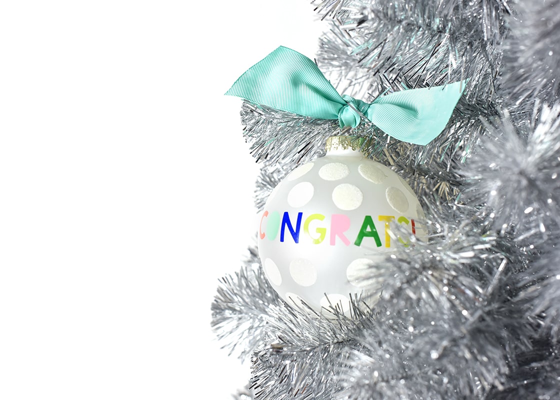 Front View of Festive Glass Ornament on 5 Foot Silver Tinsel Christmas Tree
