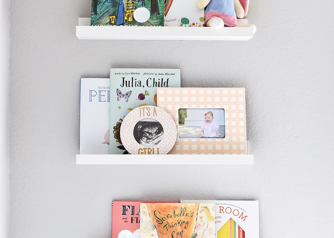 Front View of Home Decor on Shelving Including 11in Gingham Frame