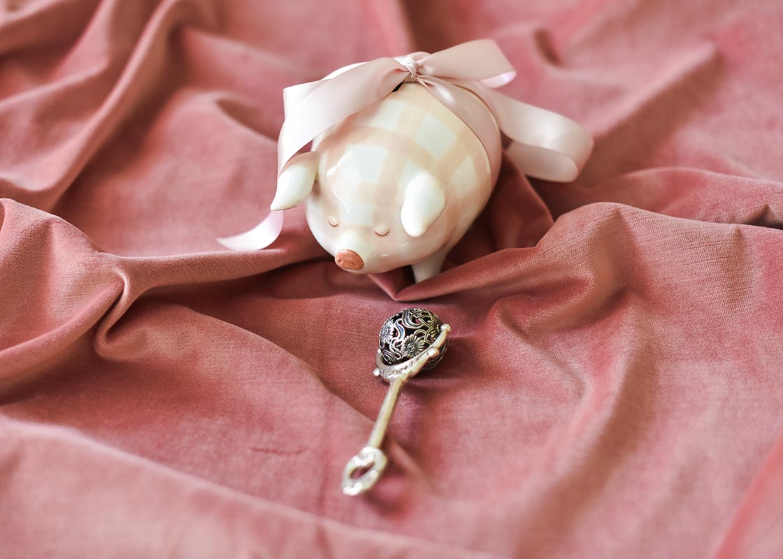 Front View of Pink Gingham Piggy Bank Tied with a Pink Satin Ribbon