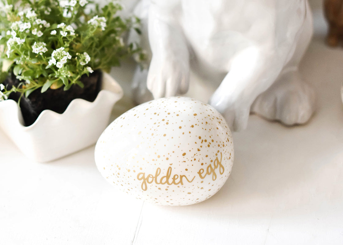 Front View of Fillable Golden Egg with Speckled Design