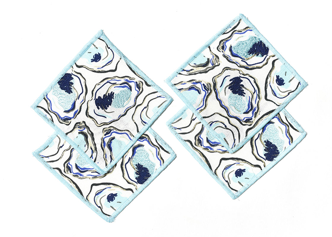 Overhead View of Creatively Placed Oyster Print Cocktail Napkins Set of 4 Showing all Pieces in Set and Personality
