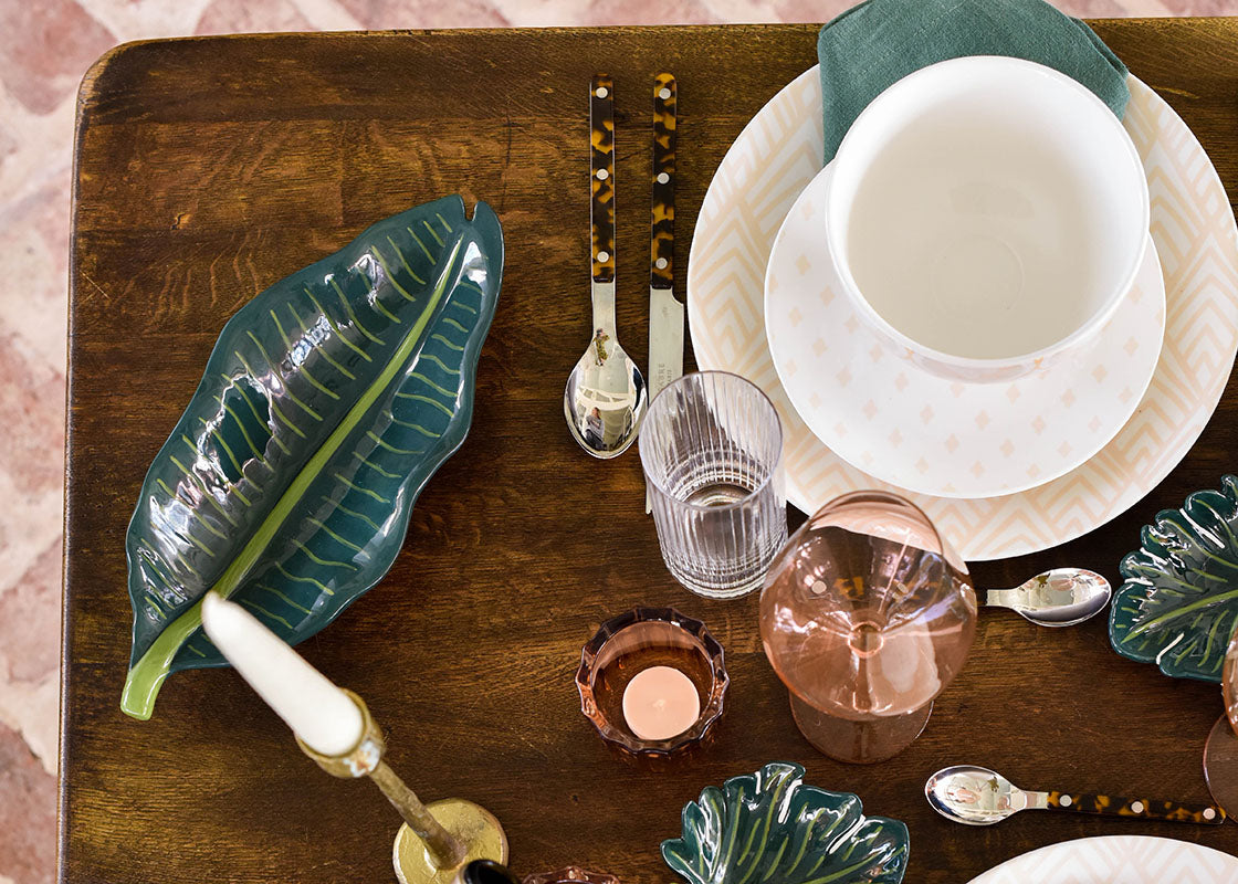 Overhead View of Blush Dinnerware with Palm Tray Decor Accents