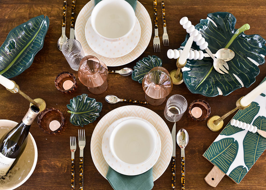 Overhead View of Tropical Tablescape with Palm Platter and Coordinating Dinnerware