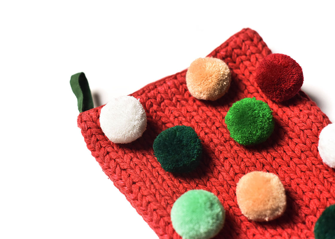 Cropped Close up of Loop Hanger and Colorful Pom Poms on Red Pom Pom Stocking