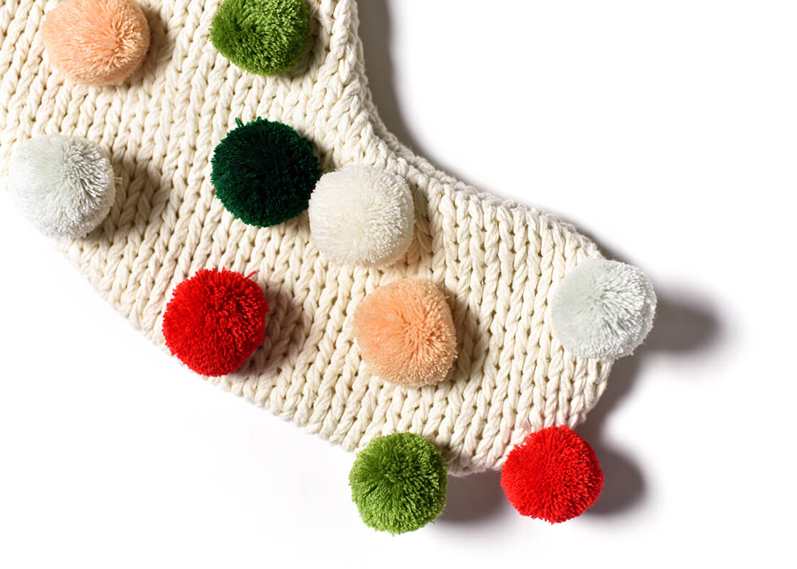 Front View of Christmas Stockings Hung on the Mantle Including Christmas Knit Stocking with Pom Poms