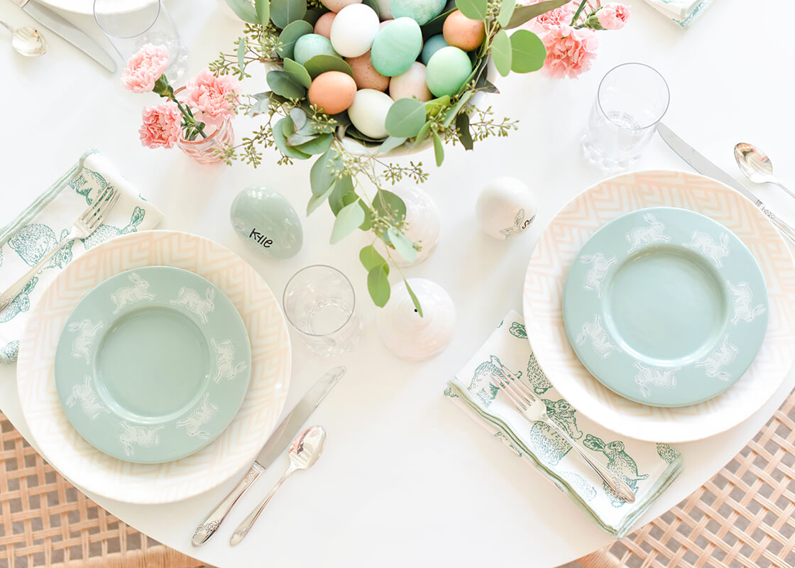 Overhead View of Two Easter Place Settings Including Speckled Rabbit Rimmed Salad Plate on Easter Tablescape