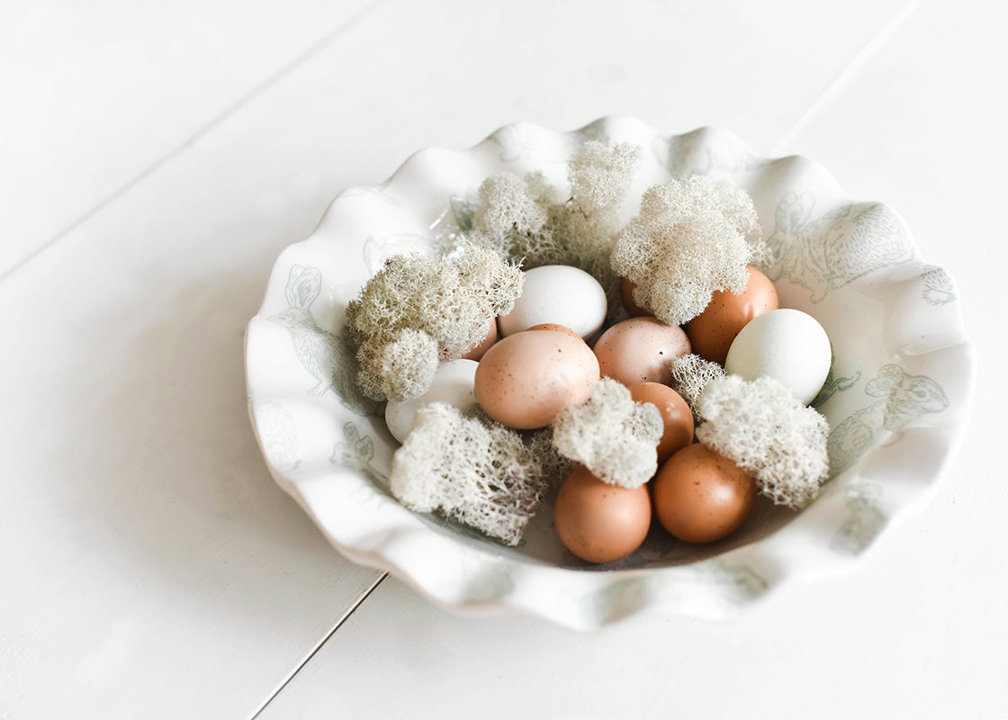 Top View of Seasonal Spring Home Decor Speckled Rabbit Ruffle Best Bowl Filled with Eggs