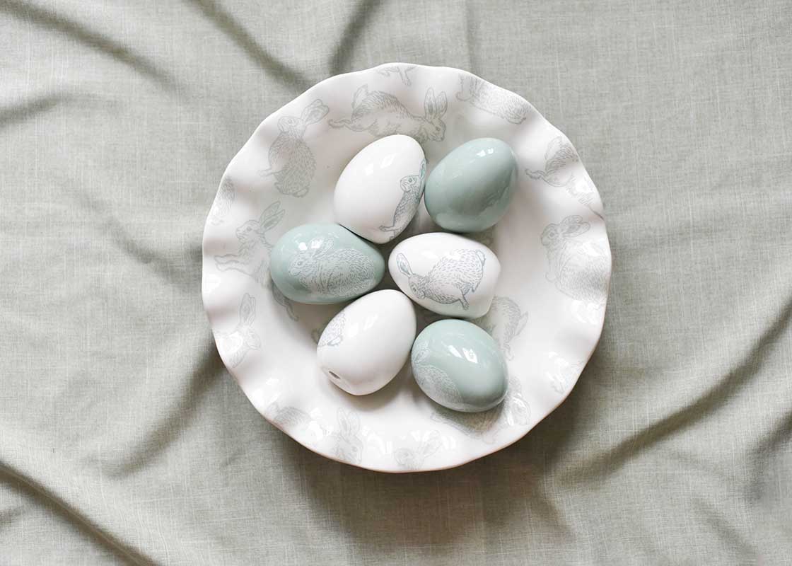 Overhead View of Speckled Rabbit 11in Ruffle Best Bowl Filled with Ceramic Easter Eggs