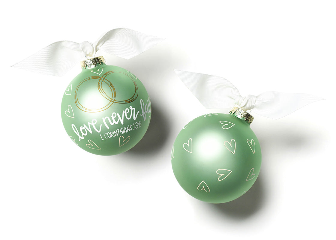 Front and Back View of Love Never Fails Glass Ornament Placed Side by Side