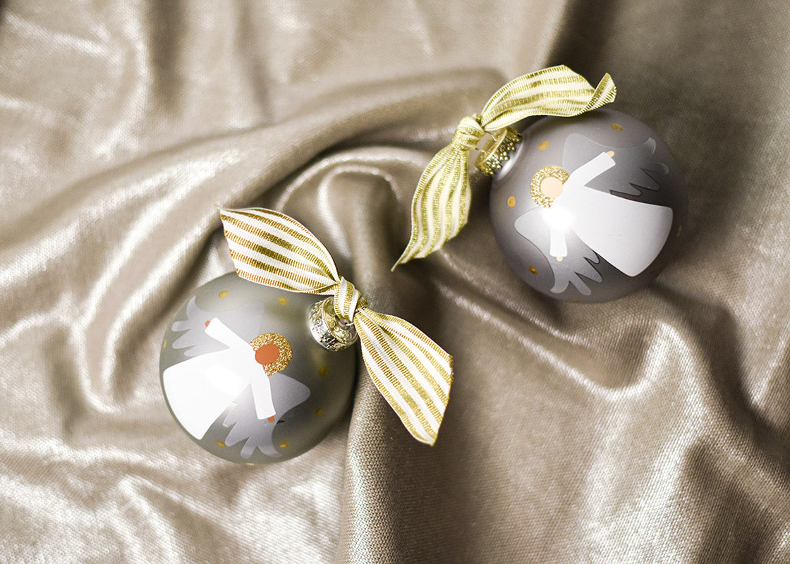 Overhead View of Forever in Our Hearts Brown Skin and Fair Skin Angel Ornaments