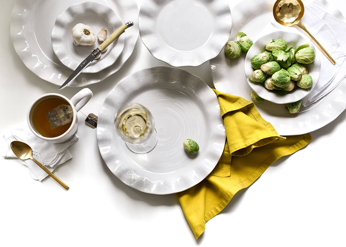 Cropped Close up of Casually Elegant Tablescape with Ruffle Design Signature White Dinnerware