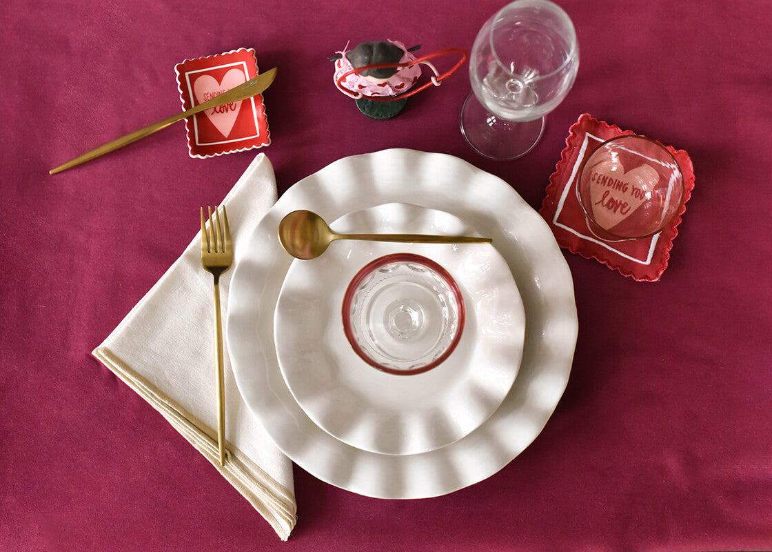 Overhead View of Pretty Valentine Place Setting with Signature White Ruffle Dinner Plate
