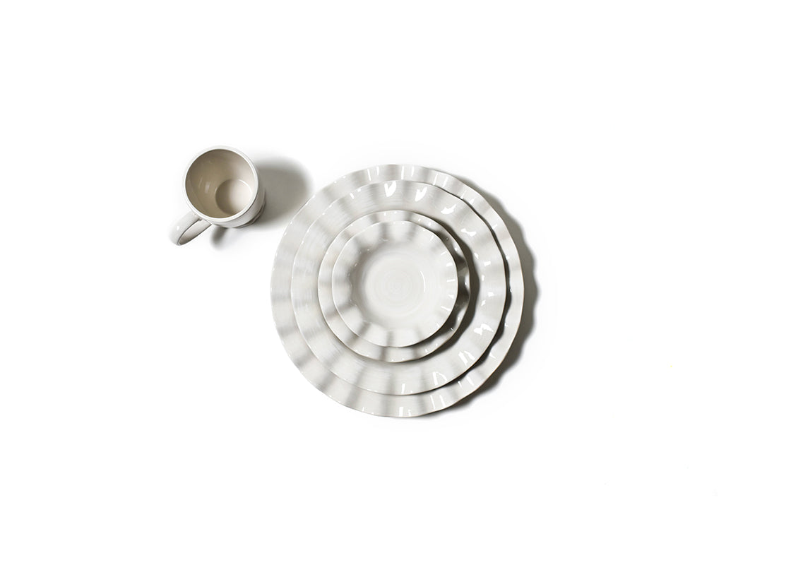 Overhead View of Stacked Coordinated Place Setting Including Signature White Ruffle Round Platter
