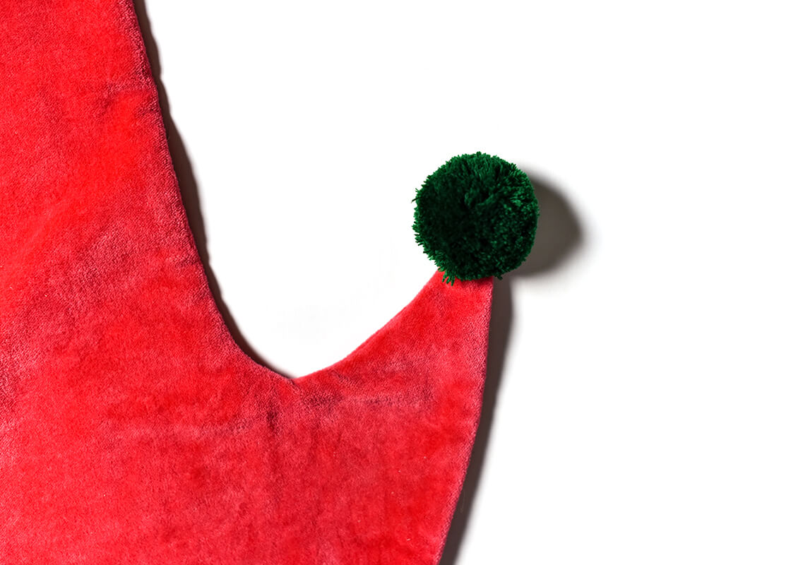Cropped Close up of Pom Pom on Toe of Red Velvet Stocking with Trim