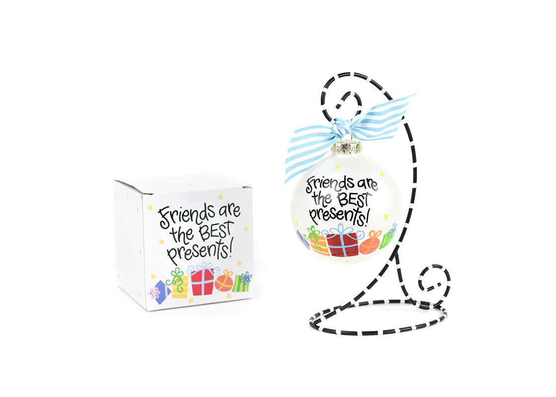 Front View of Friends are the Best Presents Glass Ornament Placed on Black and White Stripe Display Stand with Matching Box