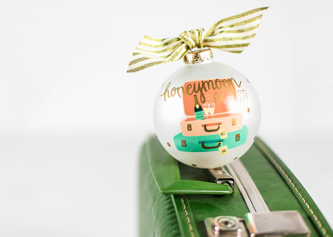 Front View of Ornament Honeymoon or Bust Design on Green Suitcase