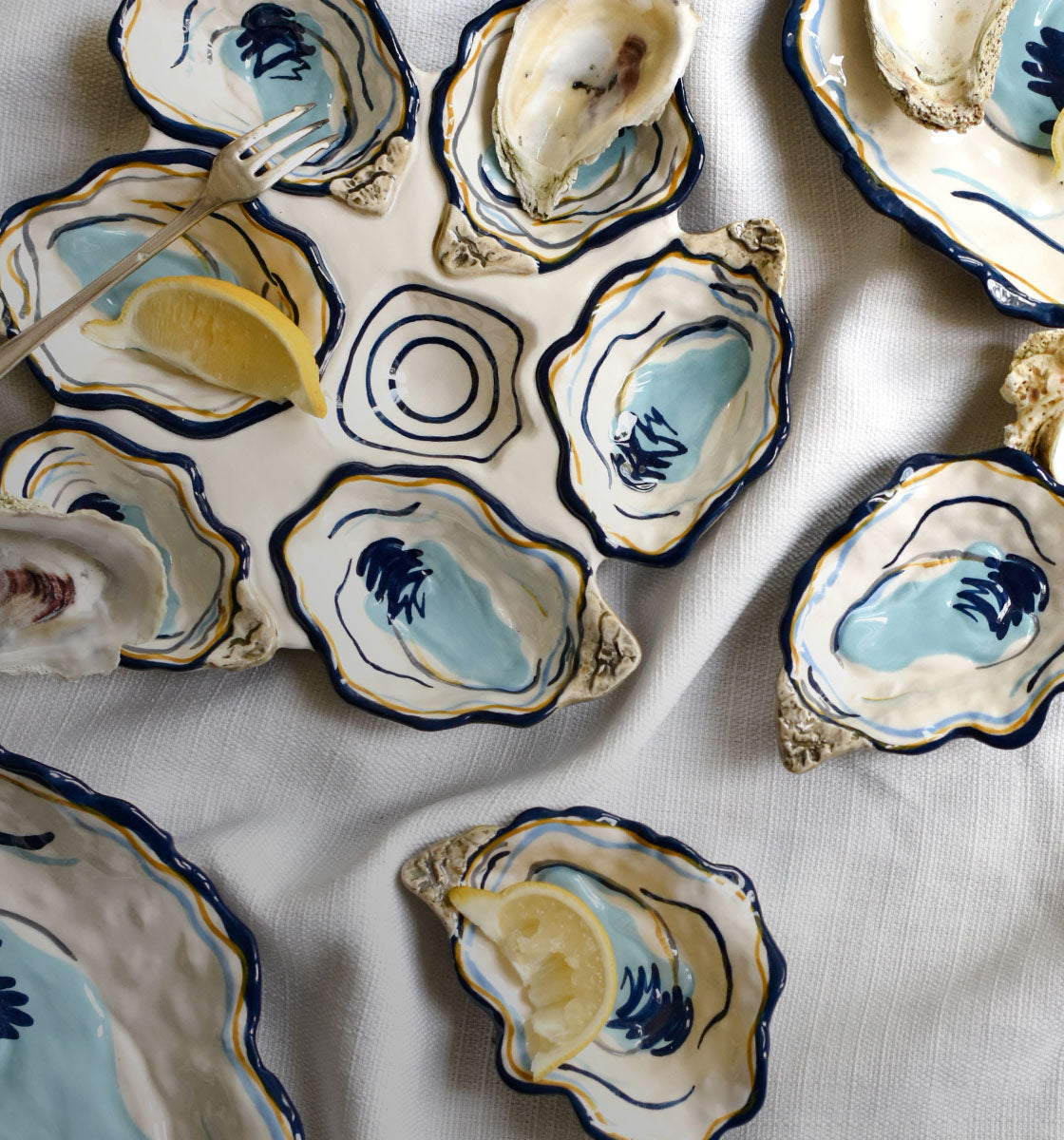 Cropped Close up of Hand-Painted Oyster Plates from Coton Colors Oyster Collection