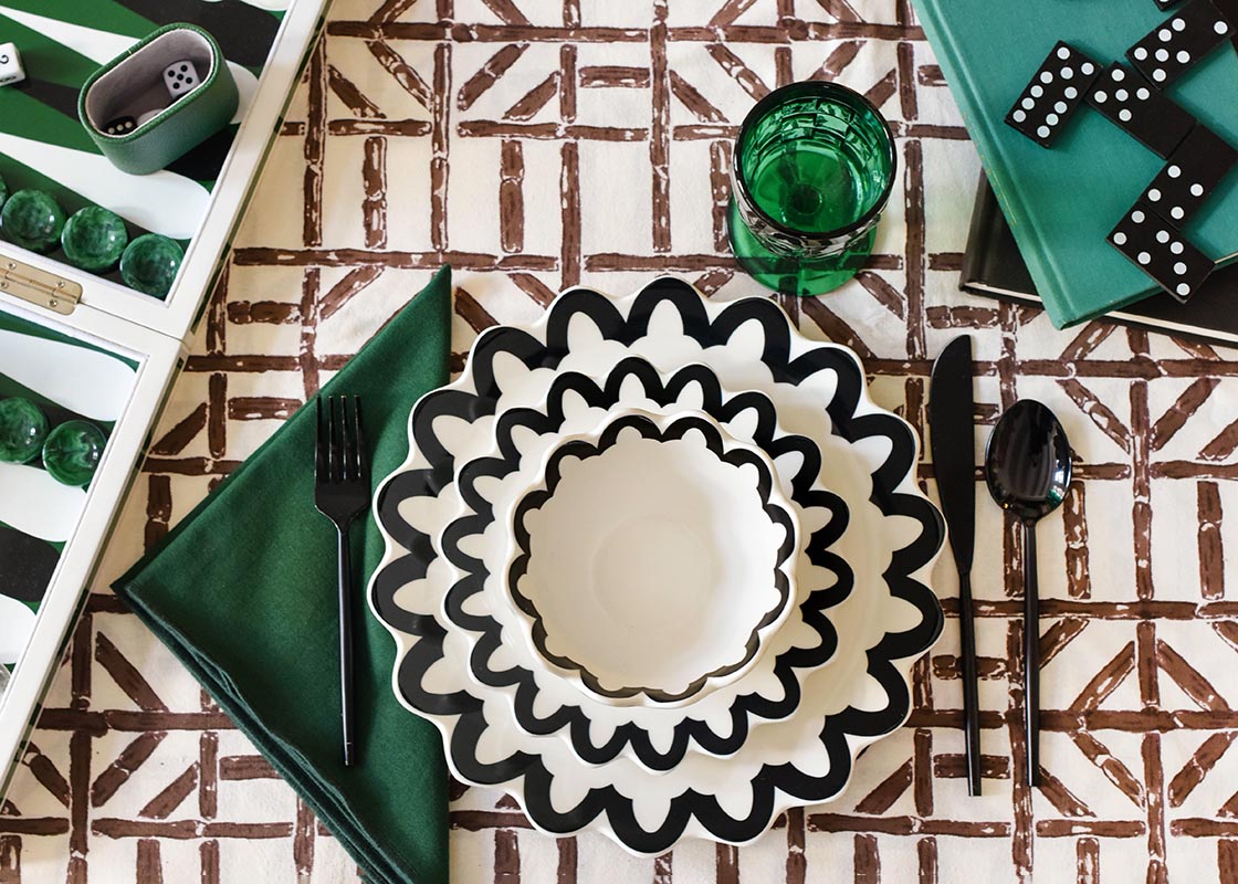 Overhead View of Individual Place Setting with Black Arabesque Trim Scallop Dinner Plate on Dominos Game Night Table
