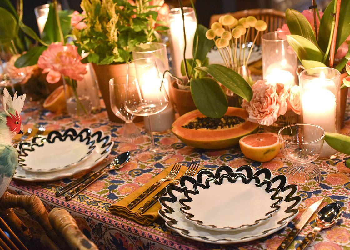 Cropped Close up of Beautiful Candlelit Tablescape Including Black Arabesque Trim Scallop Salad Plate